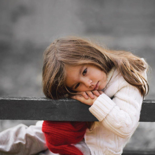 Foster child on bench